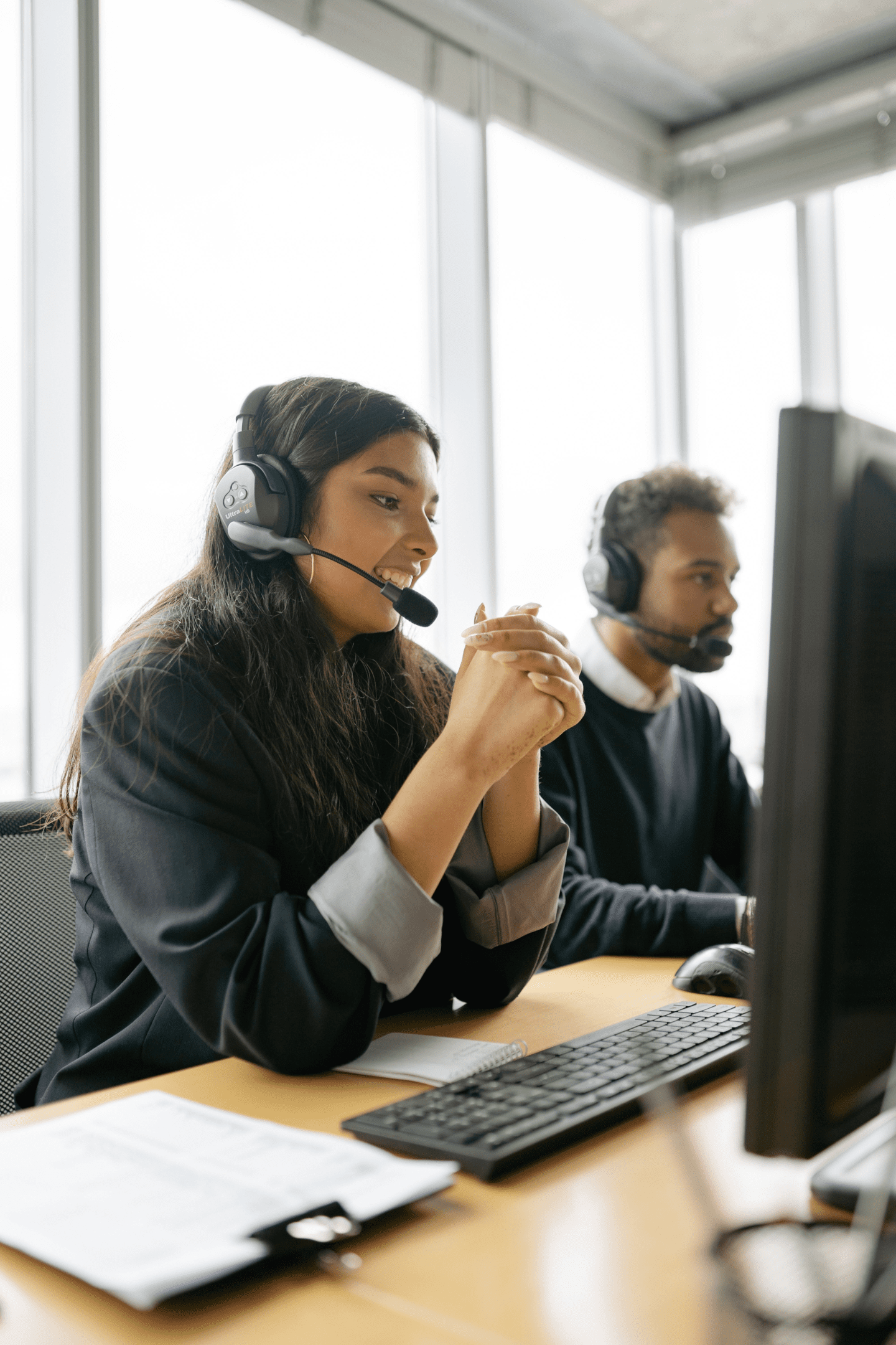 An image showing a customer service representative having a friendly conversation with a customer, demonstrating how to talk to your customers and provide personalized service.